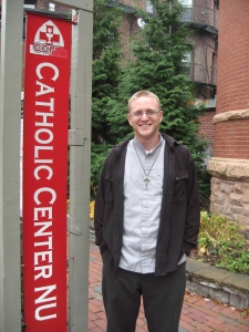 Brother Brandon Frank, the campus minister, in front of the Catholic Center at Northeastern University